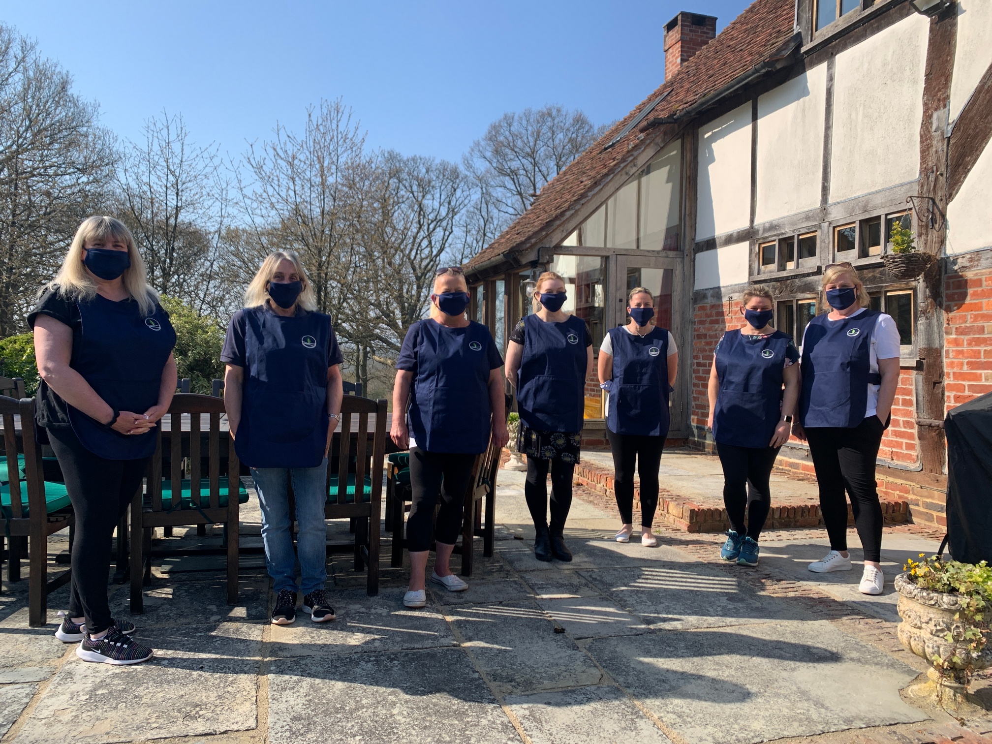 Staff wearing their embroidered tabards